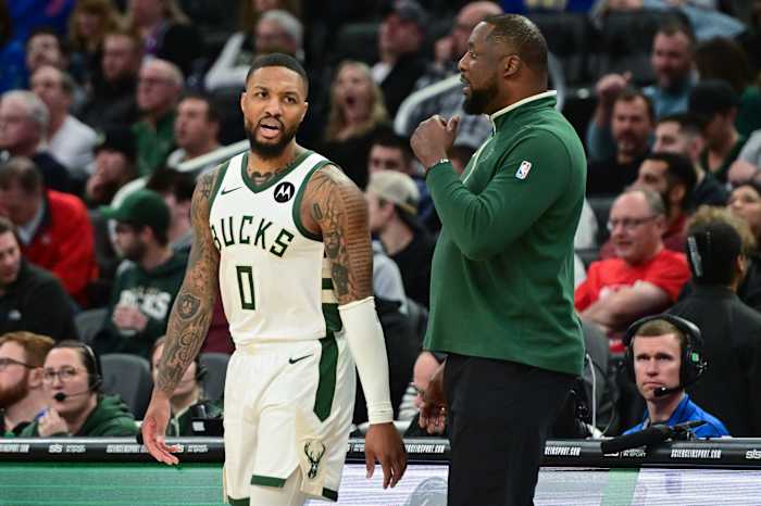 Milwaukee Bucks head coach Adrian Griffin talks to guard Damian Lillard (0)